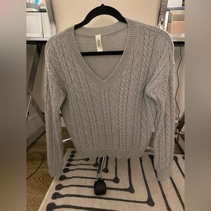 Gray V-neck cable sweater
